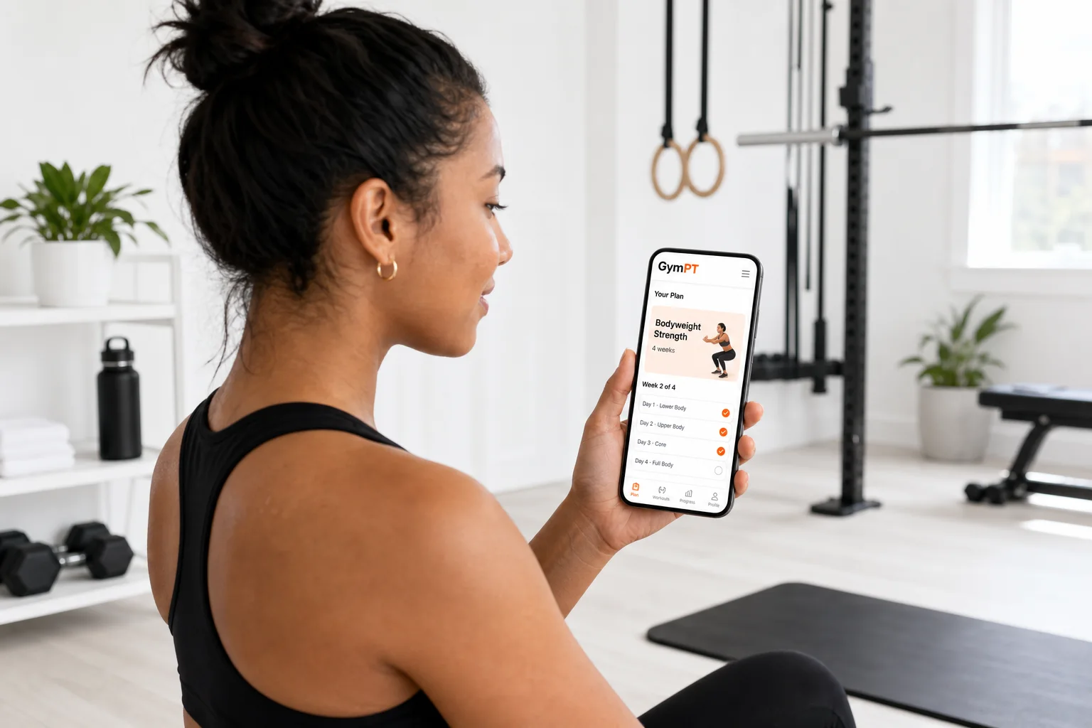 GymPT app showing a bodyweight workout plan in a modern home gym